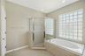Buyers will enjoy a separate soaking tub and shower, creating a relaxing spa-like experience.