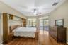The primary suite is a private retreat with lanai access and dual walk-in closets and an ensuite bathroom.