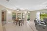 The eat-in area offers peaceful views of the back lanai and opens to the family room, creating a warm and connected gathering space.