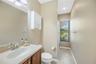 Another full bathroom with a tub/shower combination is conveniently located beside the family room and adjacent to a bedroom, making it ideal for gues