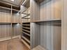 Master Walk-In Closet with custom Italian built-ins