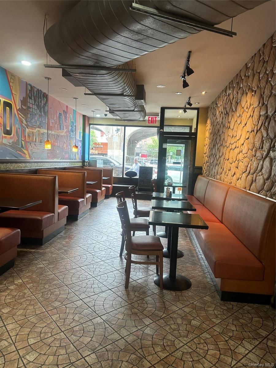 Commercial interior featuring extensive built-in booth seating