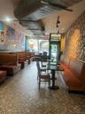 Commercial interior featuring extensive built-in booth seating