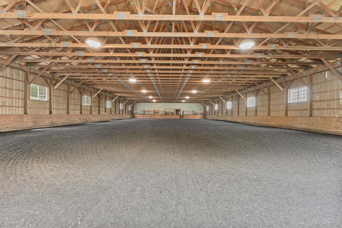 72x160 indoor riding ring connected to the barn with new footing, a new roof and new LED lighting