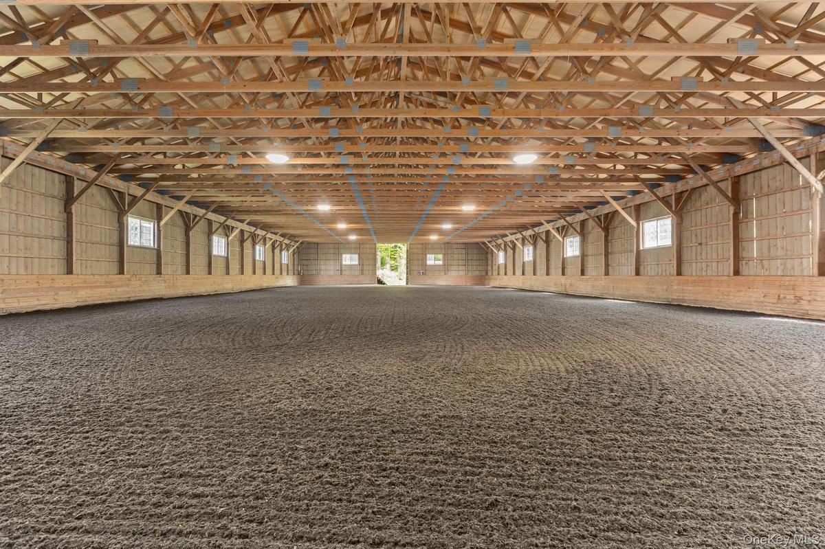72x160 indoor riding ring connected to the barn with new footing, a new roof and new LED lighting