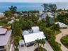 Aerial view of the property which also shows the parcel at 240 Gladiolus available for separate purchase which has 10,600+ squ ft of land and a large 