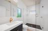 Guest ensuite bathroom (2nd bathroom) with custom cabinetry and fixtures