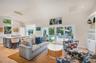 Living room with all new furnishings and decor and original artwork by local artists
