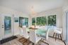 Dining area with seating for 8 and a view of the pool area
