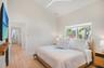 Guest bedroom with vaulted ceilings