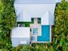 Aerial view of the main house, casita and pool area.