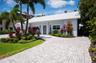 The brick paver circular driveway allows for plenty of parking