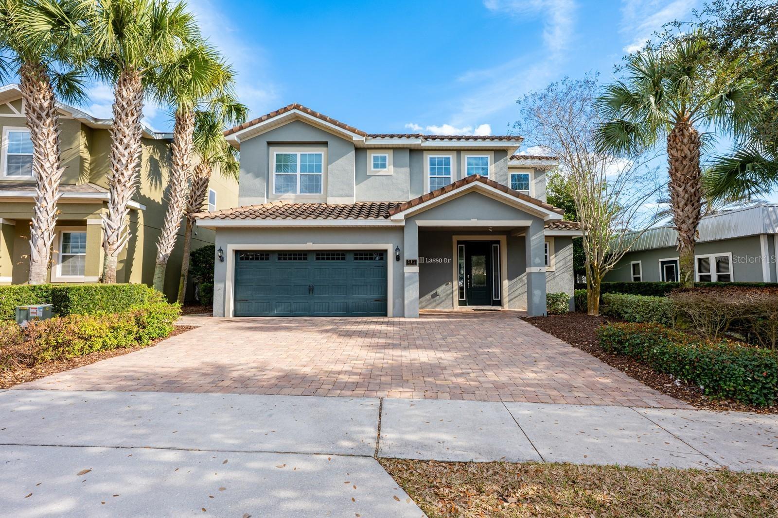 Welcome to an EXTRAORDINARY LUXURY RETREAT in the distinguished Reunion West community where elegance, scale, and unforgettable experiences come toget