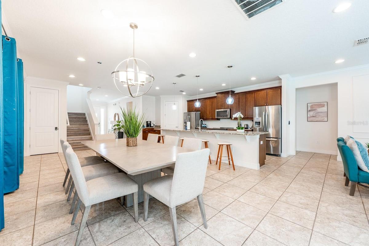 From the moment you enter, high ceilings and easy-to-maintain CERAMIC TILE FLOORING set the stage.