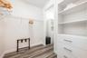 The Primary Suite walk-in closet.