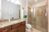 An additional bedroom and full bath are also located on the first floor.
