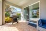 The Living Room features sliding glass doors that open to your PRIVATE OUTDOOR OASIS.