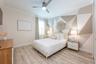 An additional bedroom and full bath are also located on the first floor.
