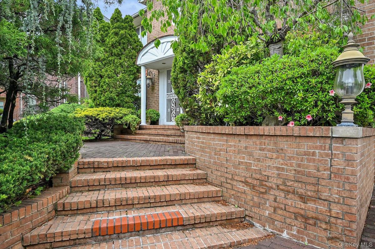Entrance to property with brick siding