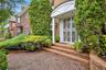 Entrance to property featuring brick siding