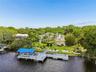 Gulf Access with a private pond. Over 150ft on NEW seawall. 10,000 lb boat lift. Still dock and floating dock.