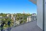 balcony off kitchen and primary bedroom