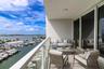 From your private balcony, take in the sights of passing boats, lush waterfront residences, and the stunning skyline beyond—all while basking in the w