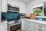 Renovated kitchen/Quartz counters, wood cabinets