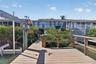 View from the dock and boat lift towards the villa.