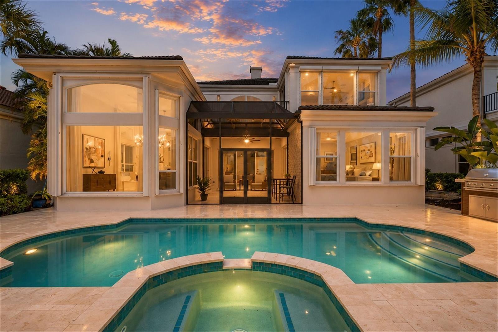 Exterior View of the Pool From the Water at Twilight