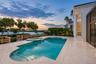 Pool with View of The Water at Sunset