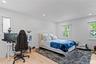 Bedroom featuring multiple windows, wood finished floors, and recessed lighting