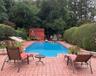 View of pool with a storage unit and a patio area