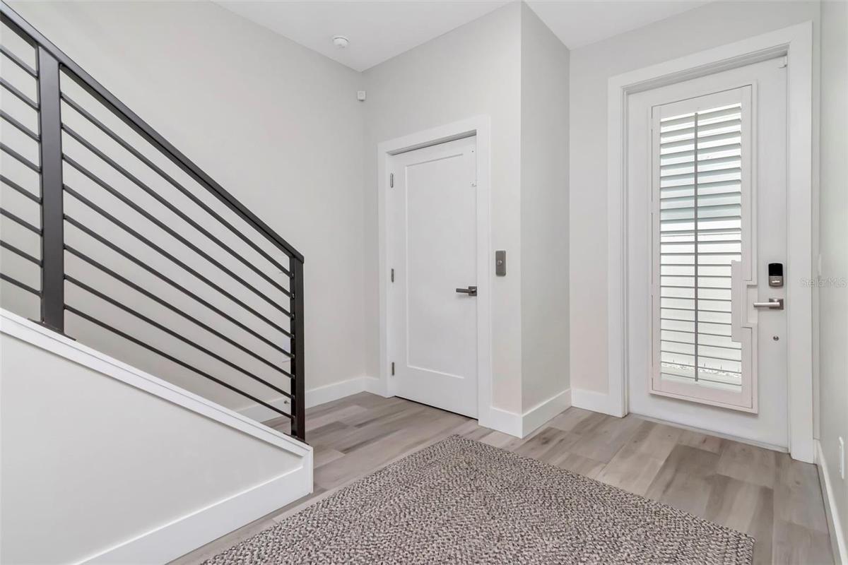 First floor entry with private elevator and stair case