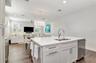 Kitchen facing dining and  living space