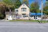 544 Route 6, Mahopac, NY — stone exterior, commercial entry, residential deck above