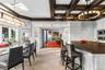 Located at the center of the home, the kitchen flows beautifully to the family rooms, dining room and outdoors
