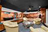Custom wood work throughout the many entertainment areas in the lower level...disco ball included!