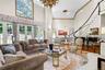 Dramatic 21 ft ceilings in the living and dining rooms. Floor to ceiling windows with french doors throughout