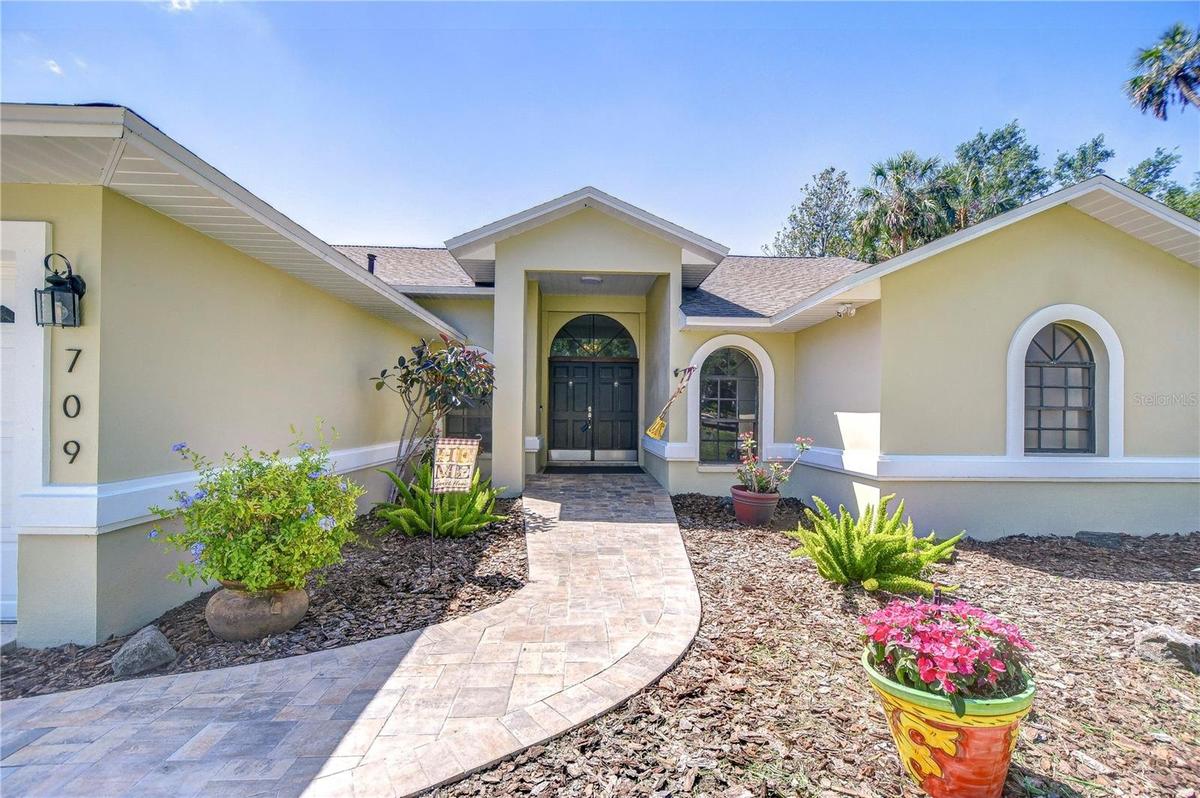 Charming Front Entry with Brick Paver Walkway