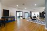 Left to Right:  (2) Step Down into Open Living Area with Wood Slat Wall Accents, Florida Room Entry with 2 sets of Double Sliding Glass Doors into the