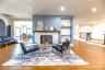 Left to Right: Dining Room Area, Fireplace Wall Cut Shelves with Wooden Shelves to the Main Living Room & Front Door, (2) Step up to Primary Bedroom E
