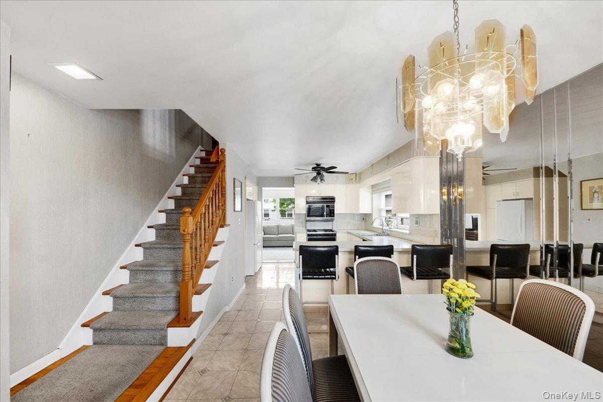 Dining area & stairs going up to 3 bedrooms