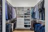 1st of 2 Custom organized walk-in closets