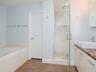 3rd level - Owners bath with soaking tub, dual vanities, and remodeled walk-in shower.
