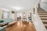 Living room featuring wood-finish flooring and a ceiling-mounted light fixture