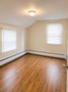Upstairs bedroom with hardwood floors and tons of light.