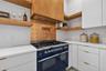 Commercial gas double oven and cooktop.