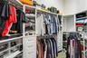 Primary bedroom walk-in closet