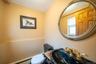 Bathroom with toilet and a baseboard heating unit